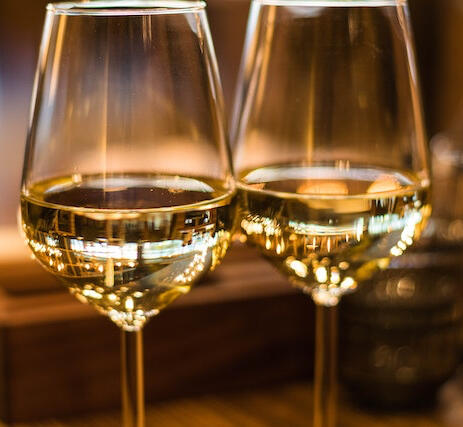 Image of two glasses of white wine.